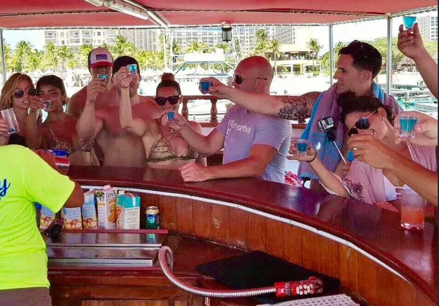 Guests sharing shots at the boat's bar during the Afternoon Pirate Party