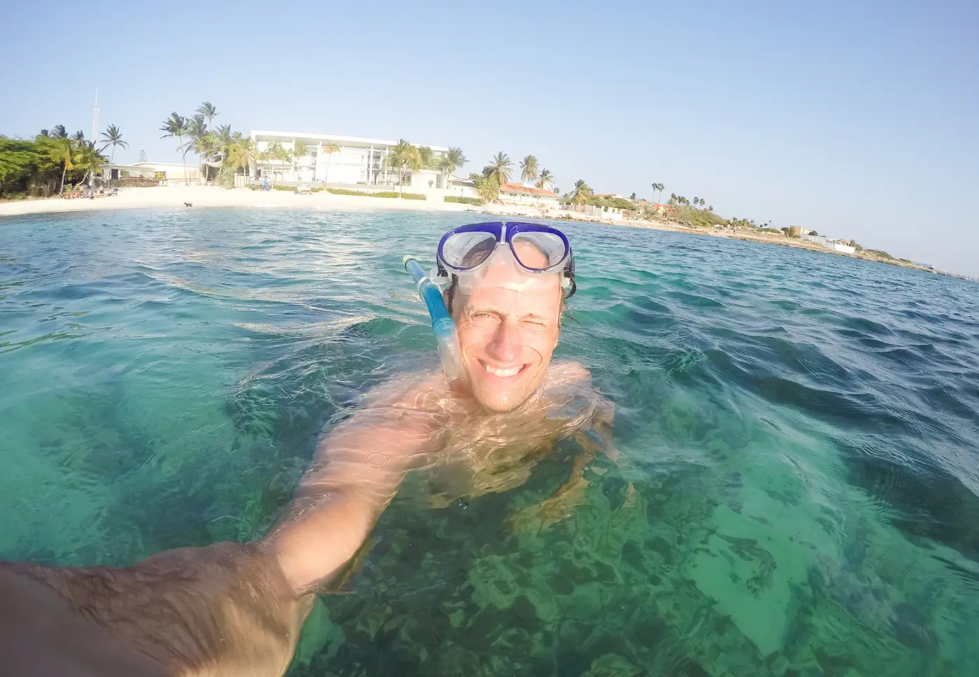 A guest snorkeling in the clear water near the SS Antilla