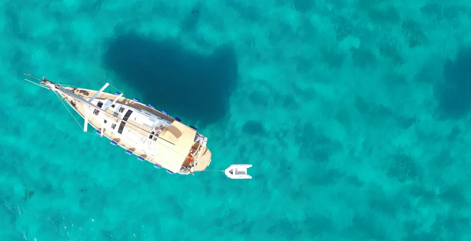 Aerial view of our schooner anchored over a reef