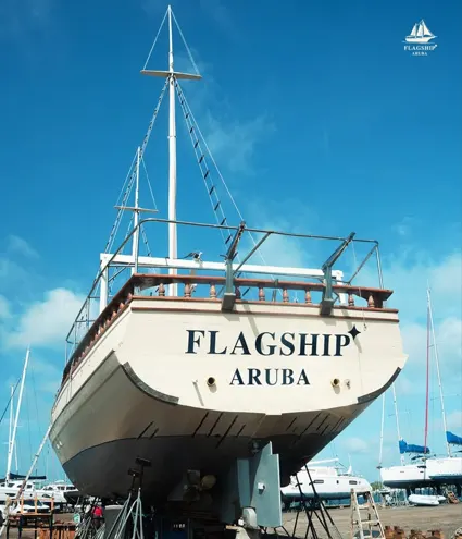 The Flagship Aruba schooner's stern, freshly painted with the boat's name
