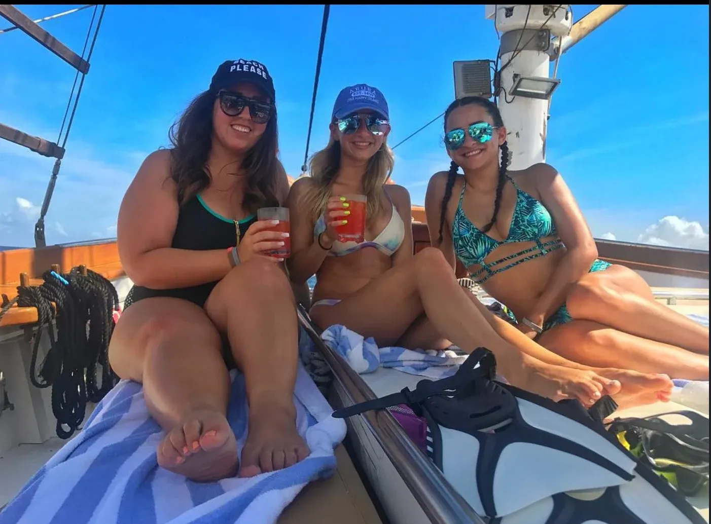 Guests toasting with drinks aboard the schooner