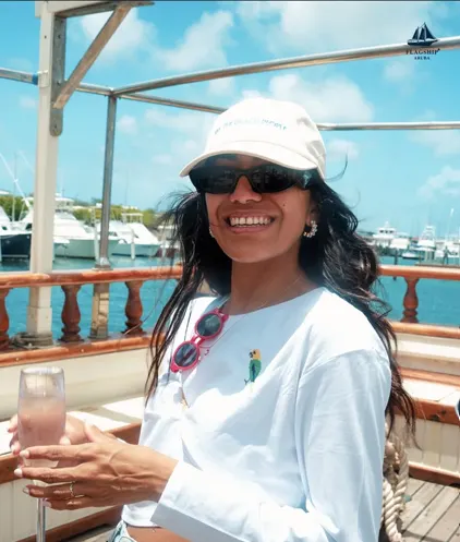 A guest enjoying a drink aboard the schooner