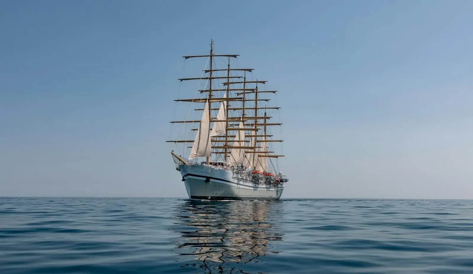 A tall ship sailing on the open water off Aruba